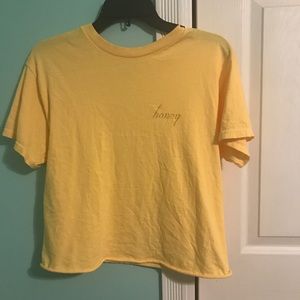 This a brandy Melville USA yellow honey shirt.